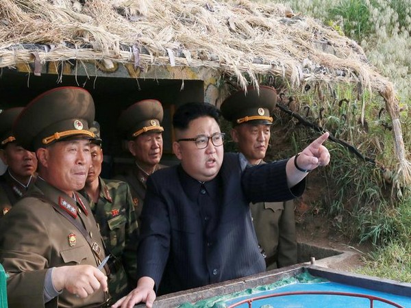 North Korean leader Kim Jong Un inspects the defence detachment on Jangjae Islet and the Hero Defence Detachment on Mu Islet located in the southernmost part of the waters off the southwest front, in this undated photo released by North Korea's KCNA